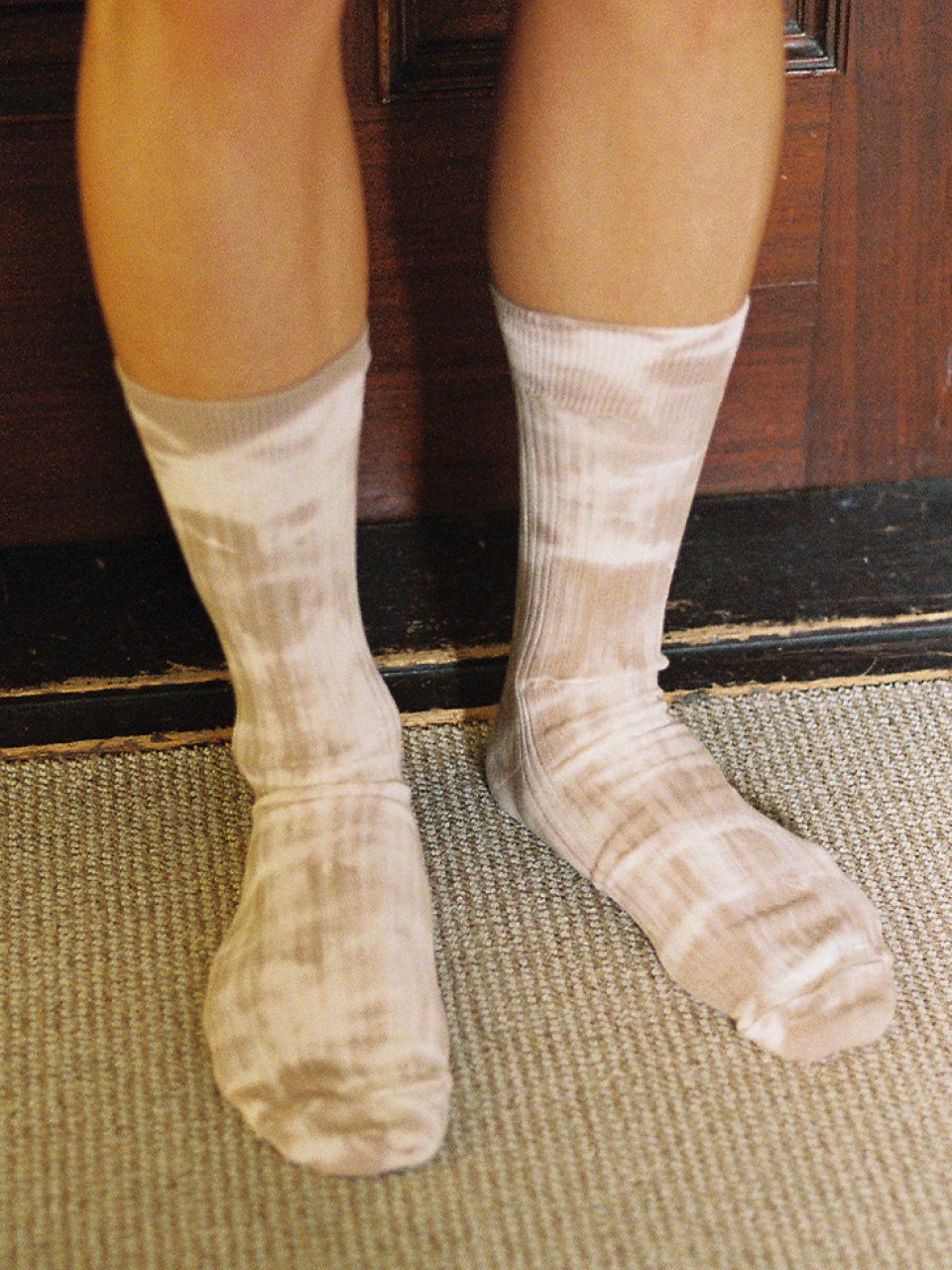 Plants tie-dye socks in blown