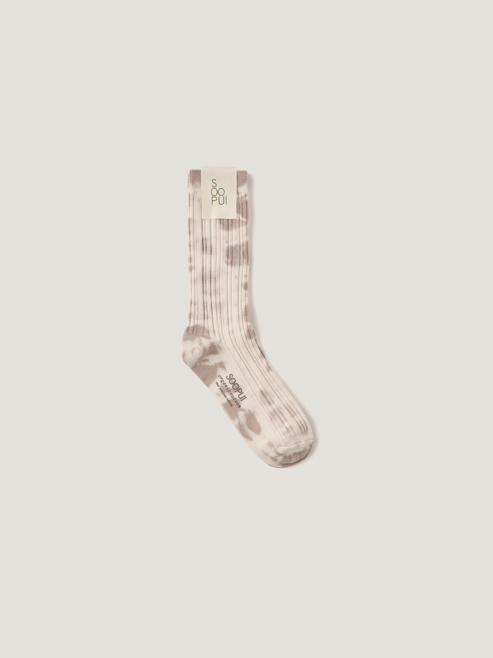 Plants tie-dye socks in blown